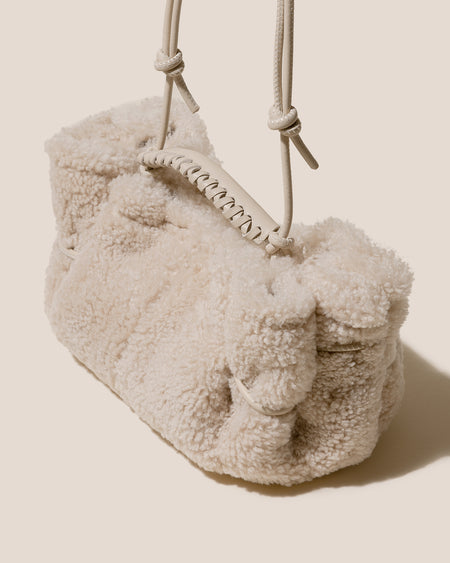 ARTA MINI CURLY SHEARLING - Pleated Crossbody Bag