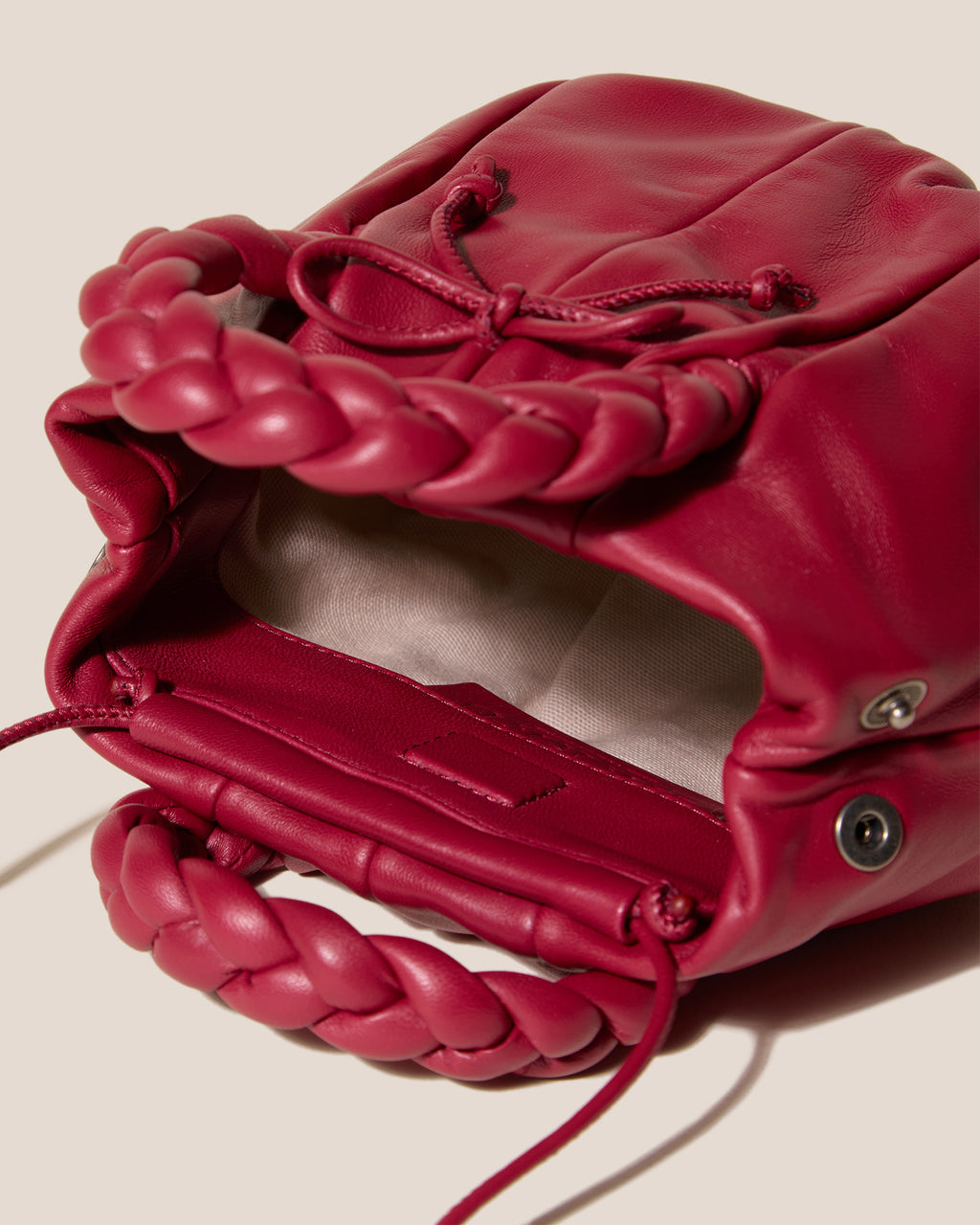 BOMBON BOW - Plaited-handle Leather Handbag