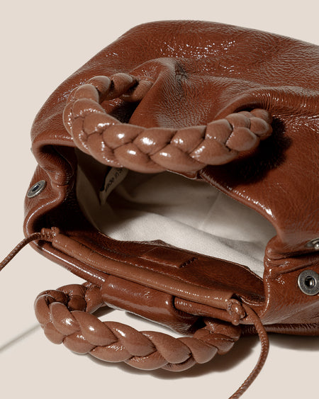 BOMBON CRINKLED GLOSSY - Plaited-handle Leather Handbag