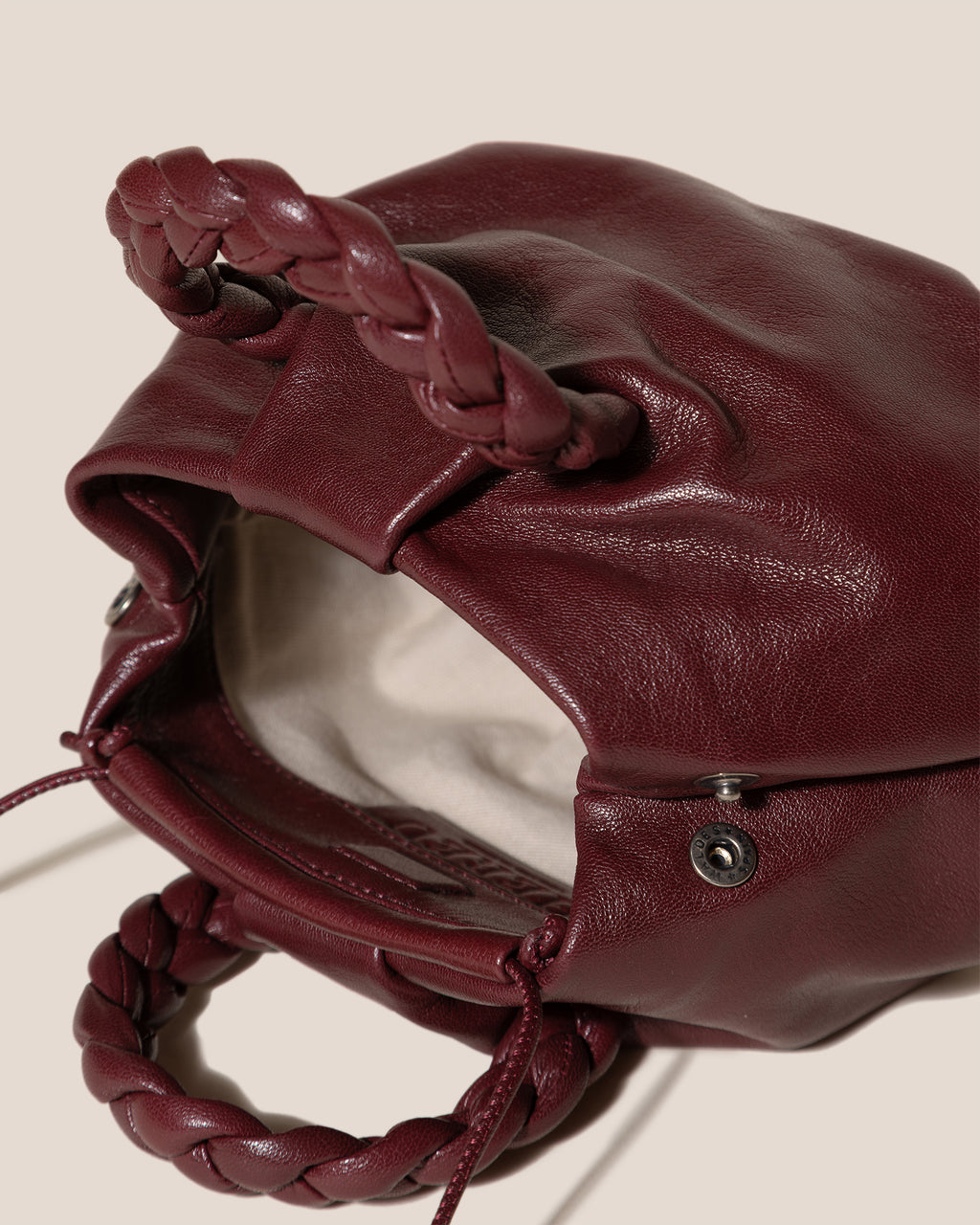 BOMBON SUPPLE SHINY - Plaited-handle Leather Handbag