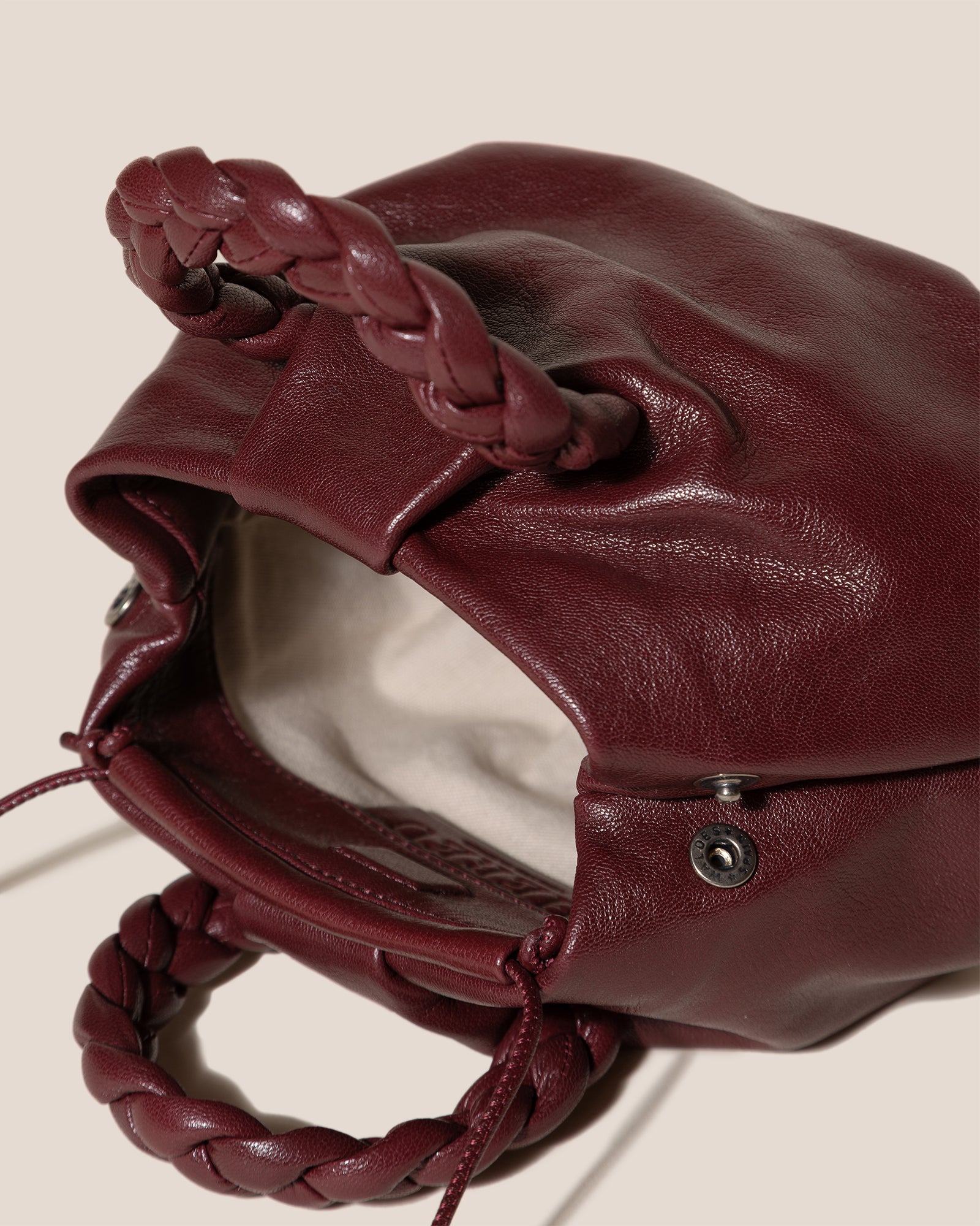 BOMBON SUPPLE SHINY - Plaited-handle Leather Handbag