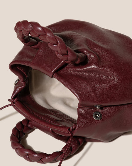 BOMBON SUPPLE SHINY - Plaited-handle Leather Handbag