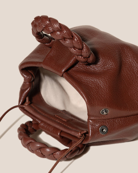 BOMBON SUPPLE SHINY - Plaited-handle Leather Handbag